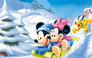 Our Favorite Disney Characters Enjoying A Snowy Adventure Wallpaper