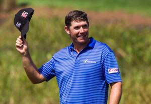 Padraig Harrington Celebrating A Successful Shot On The Golf Course Wallpaper