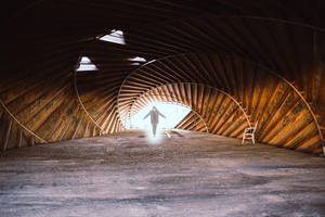 Paranormal Man In Wooden Tunnel Wallpaper