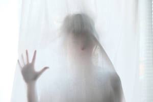 Paranormal Spooky Woman Behind Curtain Wallpaper