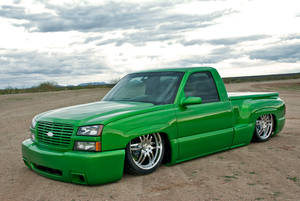 Parked Green Dropped Truck Wallpaper