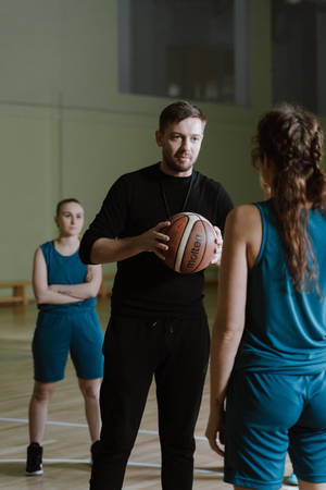 Passionate Netball Coach During Physical Education Class Wallpaper