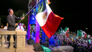 Patriotic Man Holding The Mexico Flag Wallpaper