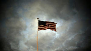 Patriotic Raised Flag Wallpaper