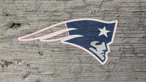 Patriots Logo In Concrete Wall Wallpaper