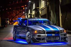 Paul Walker Behind The Wheel Of A Nissan Skyline Wallpaper
