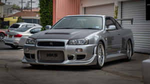 Paul Walker In His Skyline Car Wallpaper