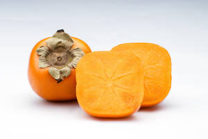 Persimmon Fruit On White Table Wallpaper