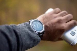 Person Wearing A Smartwatch Wallpaper