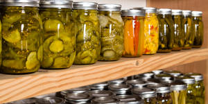 Pickles In Wooden Shelf Wallpaper