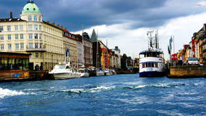 Picturesque Nyhavn Harbor In Vibrant Copenhagen Wallpaper