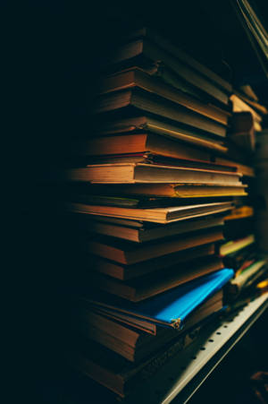 Pile Of Books In The Dark Wallpaper