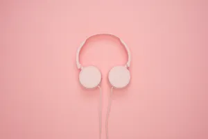Pink Headphone In Plain Color Wallpaper