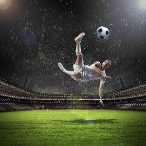 Player Kicking Soccer Ball Wallpaper