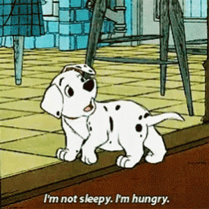 Playful Dalmatian Puppies In A Field Wallpaper