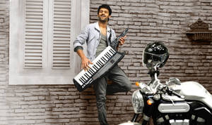 Playing Instrument Prabhas Mirchi Wallpaper