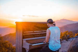 Playing Piano During Sunrise Wallpaper