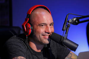 Podcast Icon, Joe Rogan Engrossed In Conversation Wallpaper