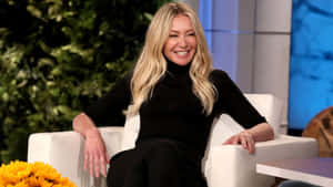 Portia De Rossi Smiling During Interview Wallpaper