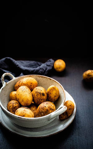 Potatoes On A White Ceramic Bowl Wallpaper