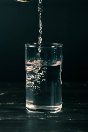 Pouring Liquid Into Glass Wallpaper