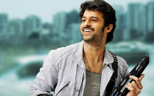 Prabhas Hd Holding An Instrument Wallpaper