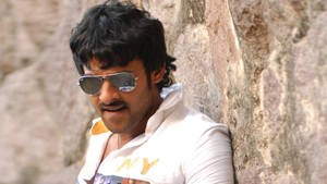 Prabhas Hd Leaning On A Rock Wallpaper