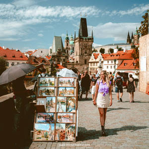 Prague Tourist Near Riverside Wallpaper