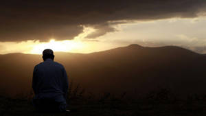 Prayer Man Looking Ahead Sunset Wallpaper