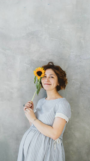 Pregnancy Woman Holding Sunflower Wallpaper