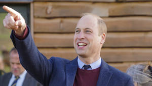 Prince William With A Cheerful Display Of Pointing And Smiling Wallpaper