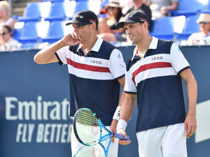 Pro Tennis Players Bob Bryan And Mike Bryan Gazing Afar Wallpaper