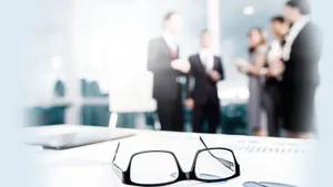 Professional Consultants Engaging In A Strategic Meeting Wallpaper