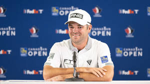 Professional Golfer Corey Conners During An Interview Wallpaper