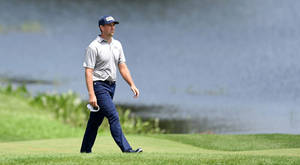 Professional Golfer Michael Thompson Strolling On The Golf Course Wallpaper