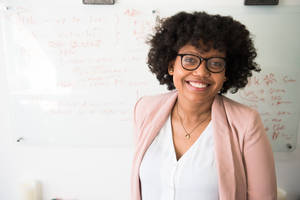 Professional Headshot Of An Outstanding Black Female Teacher Wallpaper