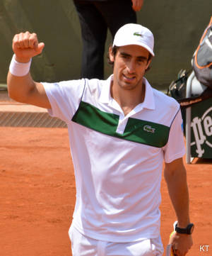 Professional Tennis Player Pablo Cuevas Celebrating Victory Wallpaper