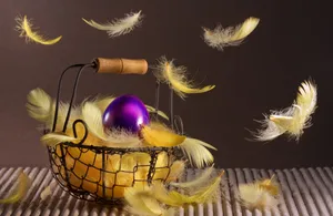 Purple Easter Egg With Yellow Feathers Wallpaper
