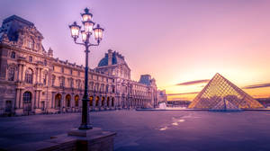 Purple Sunset In Louvre France Wallpaper