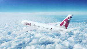 Qatar Airways Above A Fluff Of A Cloudy Sky Wallpaper