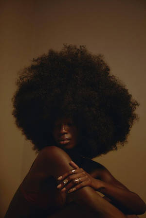 Radiant Beauty: Stunning Black Woman With Gorgeous Hair Wallpaper