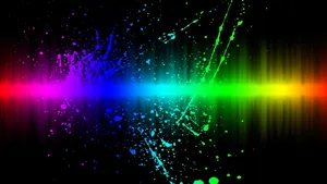 Rainbow Splatters On A Black Background Wallpaper