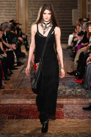 Ralph Lauren Corporation Serious With Bag Wallpaper