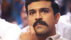 Ram Charan Hd Playing With Mustache Wallpaper