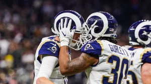 Rams Players Are Congratulating Each Other On The Field Wallpaper