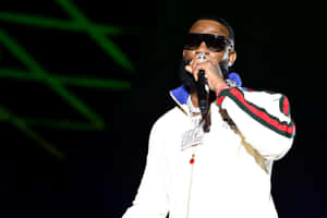 Rapper Performingon Stage Wallpaper