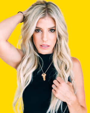 Rebecca Zamolo Striking A Pose Against An Abstract Background Wallpaper