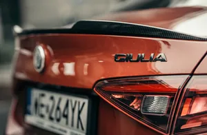 Red Alfa Romeo Giulia: Powerful And Luxurious Wallpaper