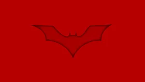 Red Batman Logo Jumping Off A Building Wallpaper
