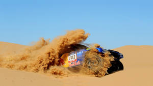 Red Bull Racing Car In Desert Wallpaper